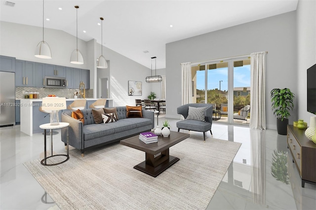 living room with high vaulted ceiling