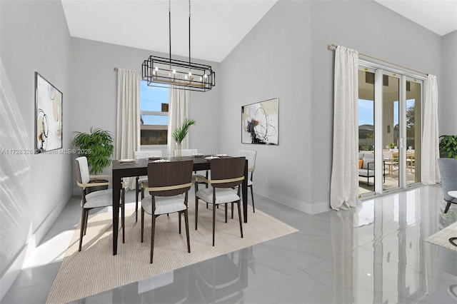 dining space featuring a notable chandelier