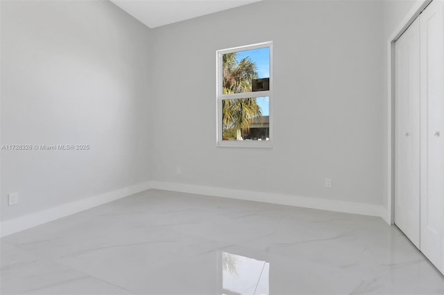 unfurnished bedroom with a closet