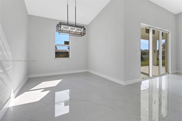 unfurnished dining area with a chandelier