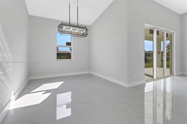 unfurnished dining area with an inviting chandelier