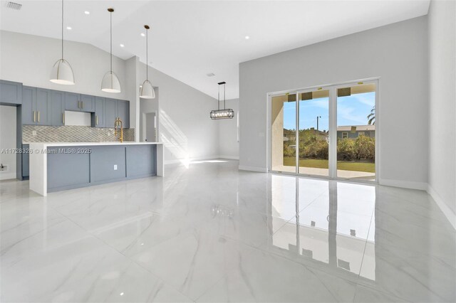 kitchen featuring hanging light fixtures and backsplash