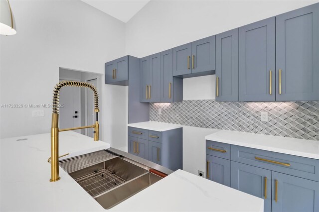 kitchen featuring sink and backsplash