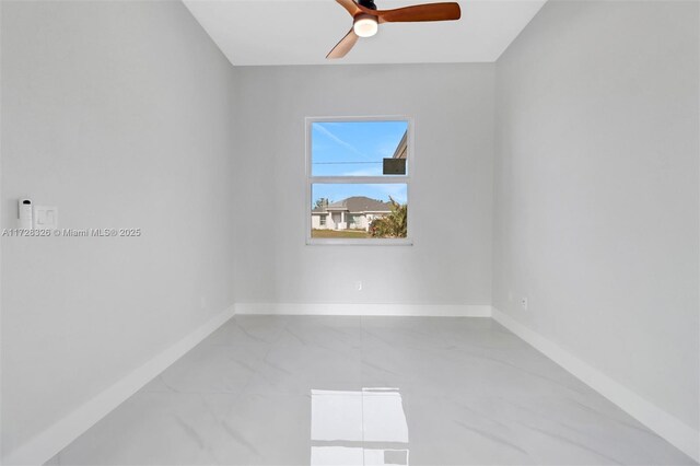 unfurnished room with ceiling fan