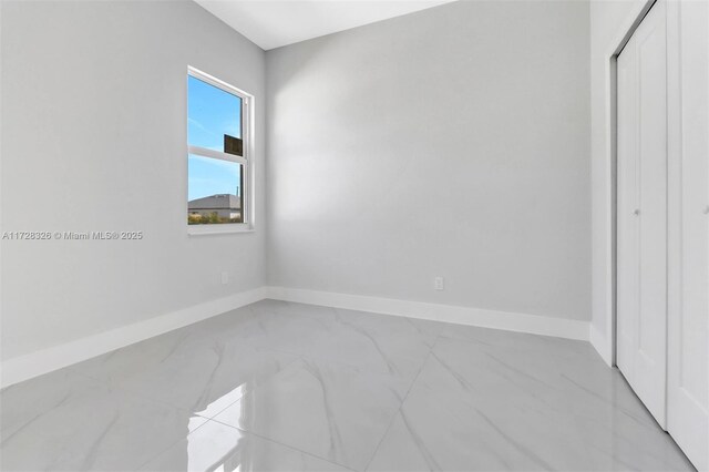 unfurnished bedroom featuring a closet