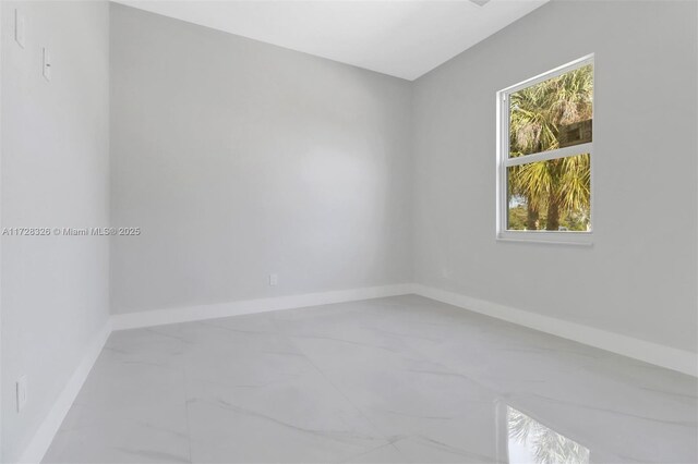 unfurnished room featuring a wealth of natural light