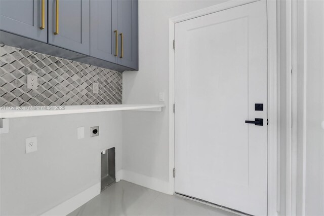 washroom featuring cabinets and electric dryer hookup