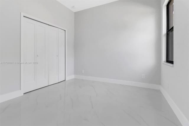 unfurnished bedroom with a closet