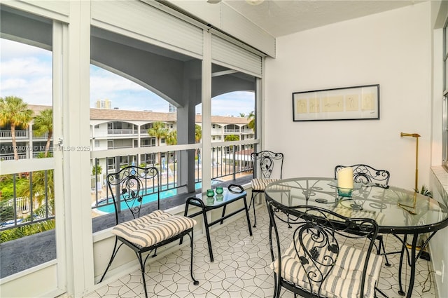 sunroom / solarium featuring plenty of natural light