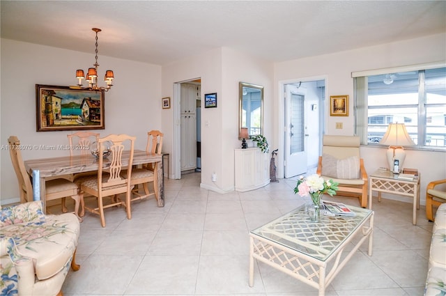 living room featuring light tile patterned flooring and a chandelier