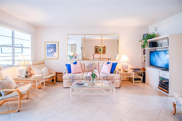 living room with a textured ceiling and light tile patterned floors