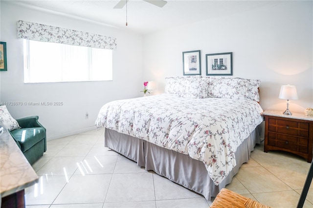 tiled bedroom featuring ceiling fan