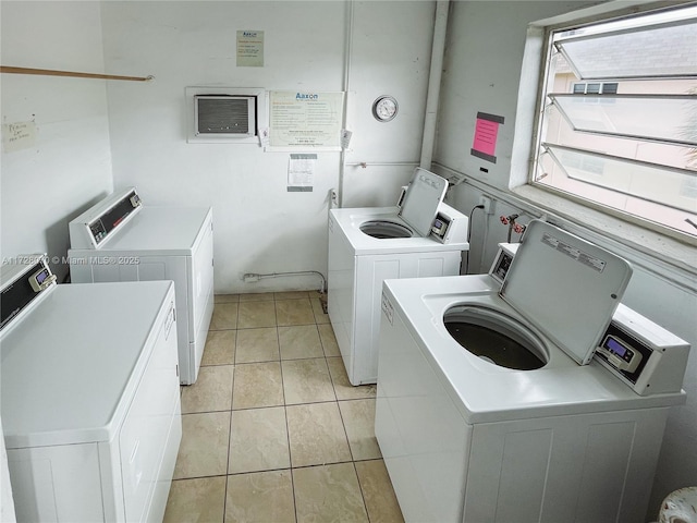 laundry room featuring light tile patterned floors and independent washer and dryer