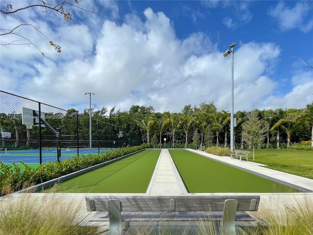 surrounding community with tennis court