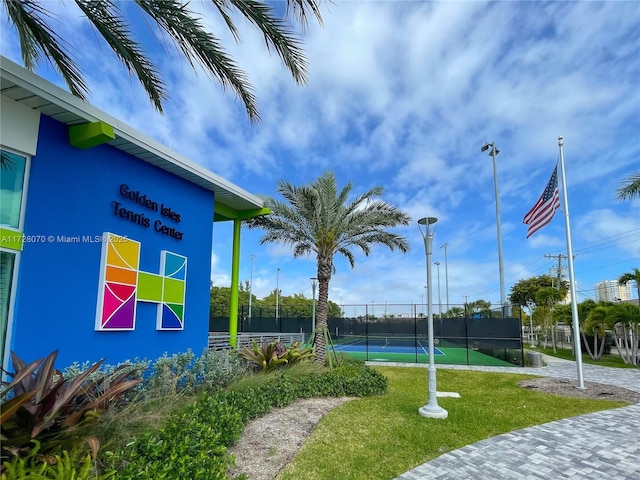 view of community featuring tennis court