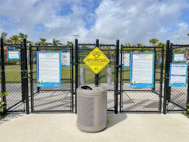 view of gate featuring central AC unit