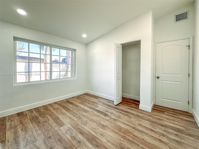 unfurnished bedroom with light wood-type flooring