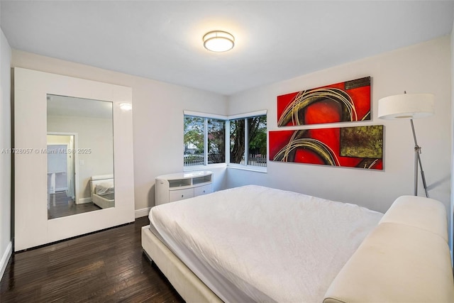 bedroom with hardwood / wood-style floors