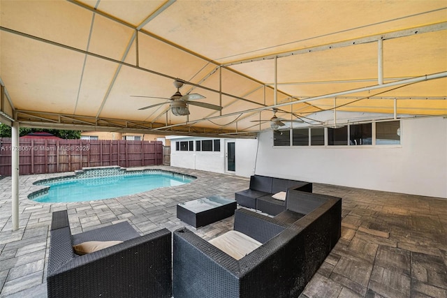 view of pool with ceiling fan, an outdoor living space, and a patio