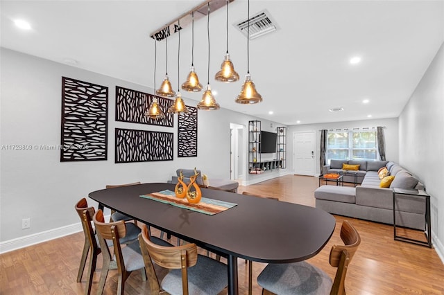 dining area featuring light wood-type flooring