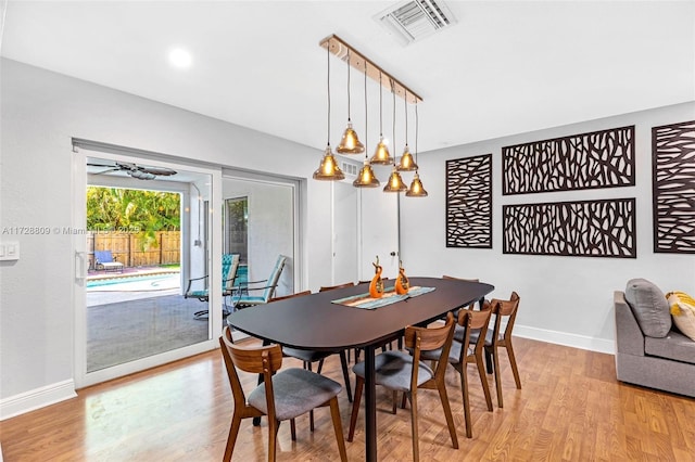 dining space with light wood-type flooring