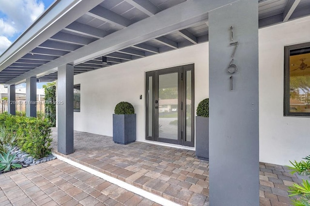 entrance to property with a patio