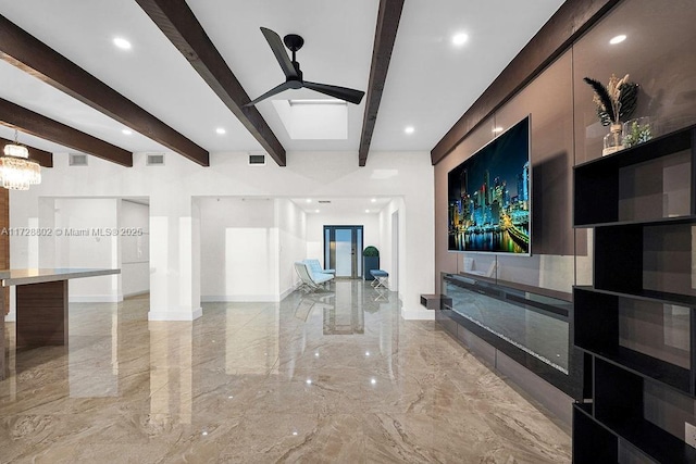 living room with ceiling fan and beamed ceiling