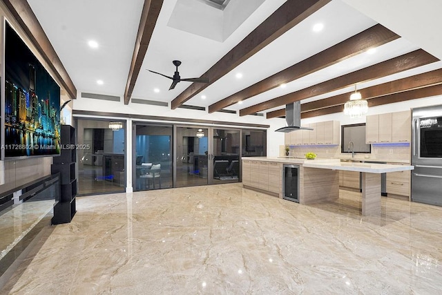 kitchen with exhaust hood, backsplash, beam ceiling, hanging light fixtures, and beverage cooler