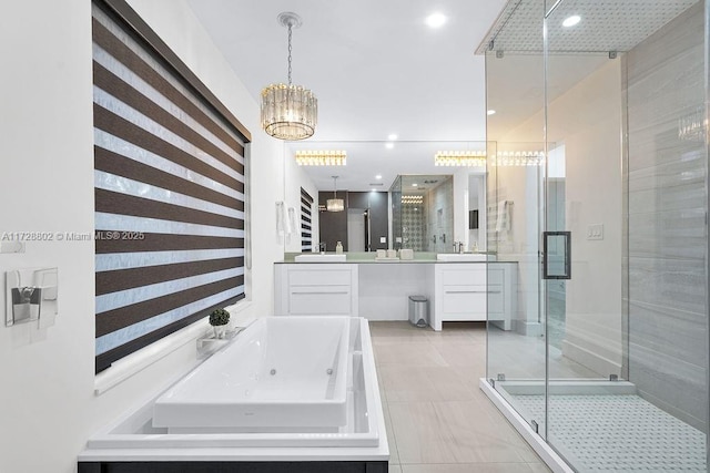 bathroom featuring independent shower and bath, tile patterned flooring, and vanity