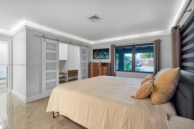 bedroom with a barn door