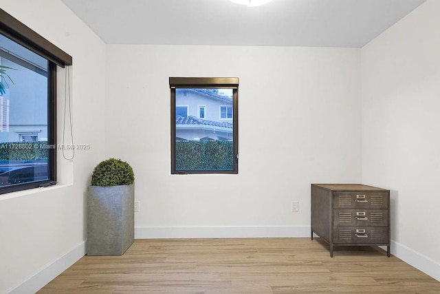 spare room featuring light hardwood / wood-style flooring