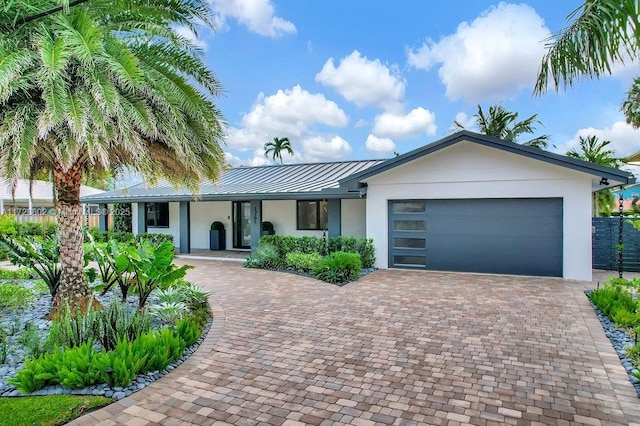 view of front of property with a garage