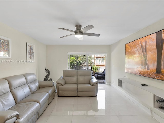 living room featuring ceiling fan and light tile patterned floors