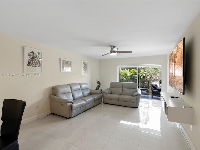 living room with ceiling fan and light tile patterned floors