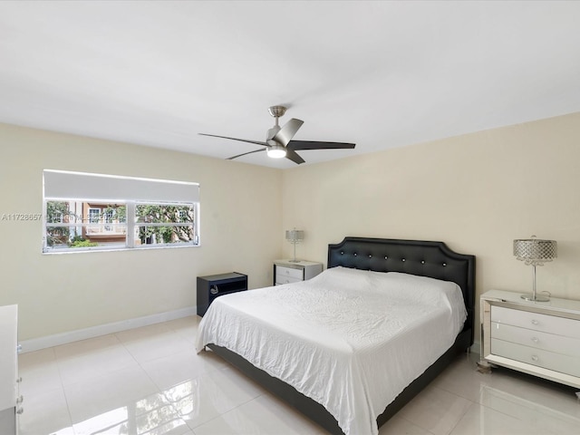 tiled bedroom with ceiling fan