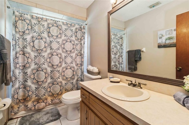 bathroom with toilet, vanity, walk in shower, and tile patterned flooring