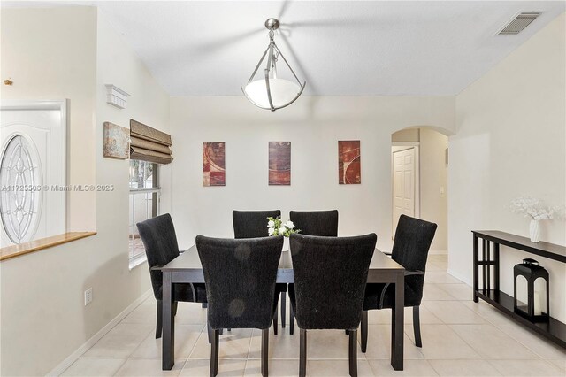 dining area featuring light tile patterned floors