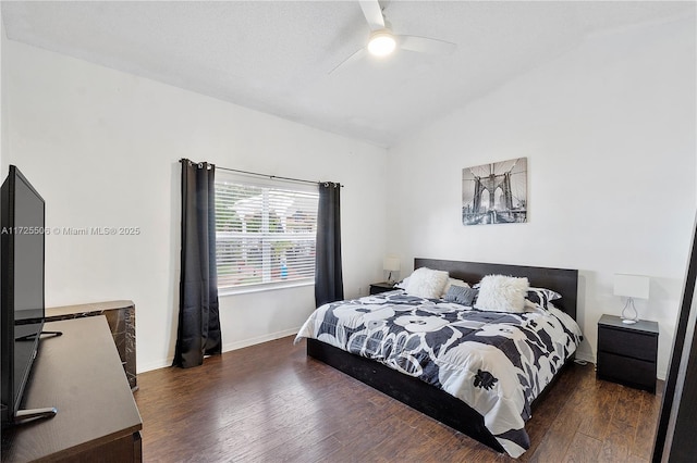 bedroom featuring lofted ceiling, ceiling fan, and dark hardwood / wood-style floors