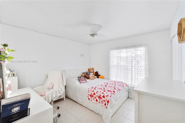 tiled bedroom featuring ceiling fan