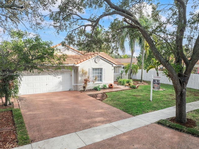 view of front of house featuring a front yard and a garage