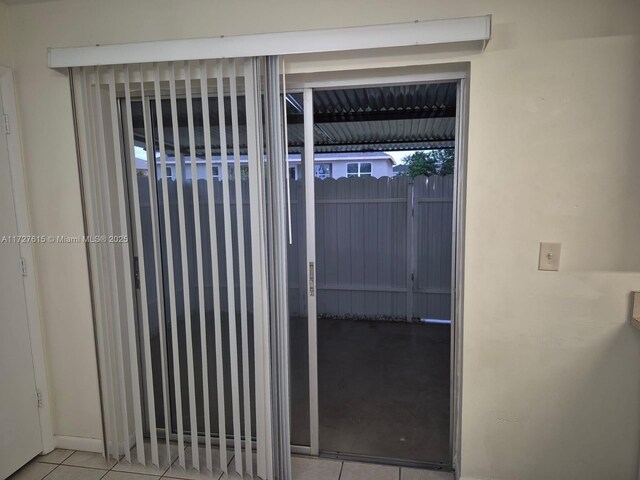 unfurnished room featuring tile patterned flooring