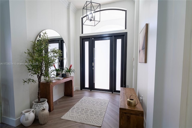 entrance foyer with an inviting chandelier and a high ceiling