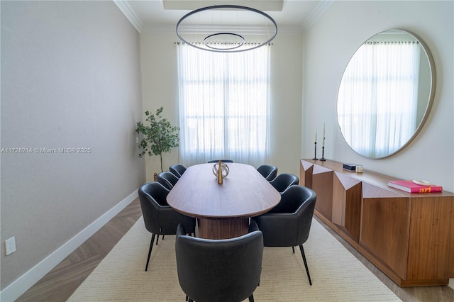 dining room featuring crown molding