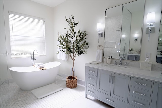 bathroom with vanity, tile patterned flooring, and shower with separate bathtub