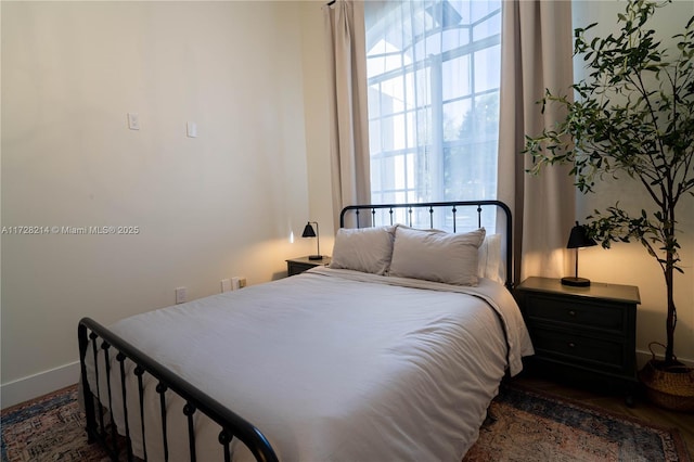 bedroom featuring dark hardwood / wood-style flooring