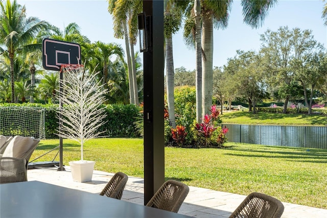 view of yard with a patio and a water view