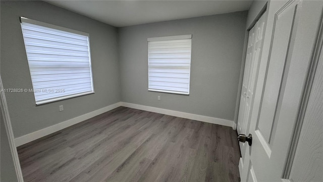 unfurnished bedroom featuring light hardwood / wood-style flooring and a closet