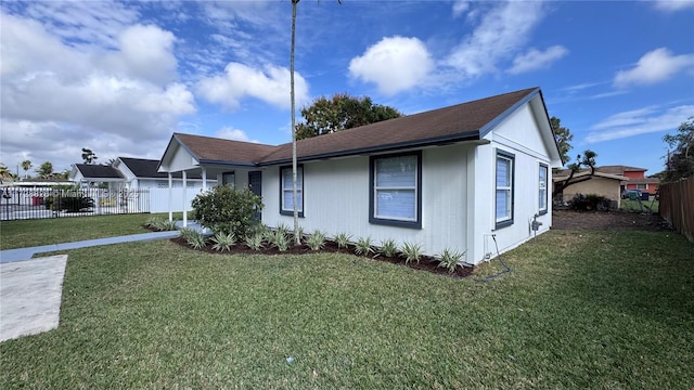 view of front of property with a front lawn