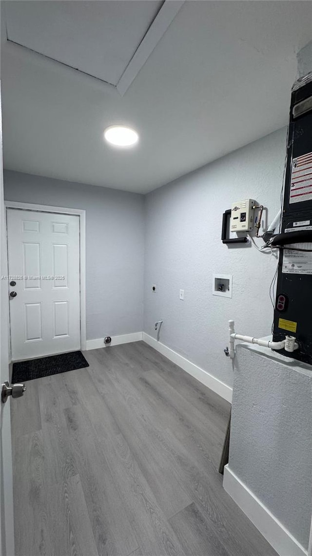 washroom featuring gas dryer hookup, washer hookup, and hardwood / wood-style floors