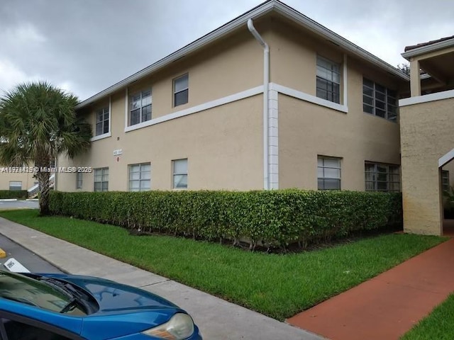 view of property exterior featuring a yard